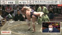 右手が髷に