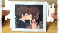 【映像】夜景を眺める→キスする2人の紙動画